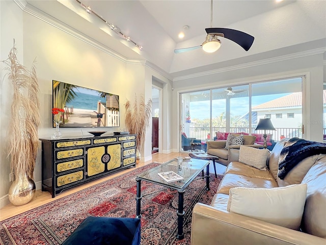 living room with crown molding and vaulted ceiling