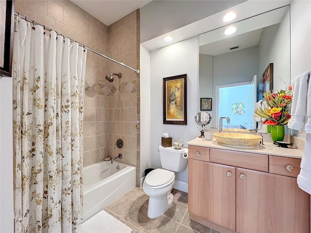 full bathroom with tile patterned flooring, vanity, toilet, and shower / bath combo with shower curtain