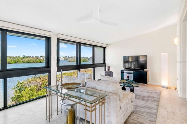 living area featuring a water view