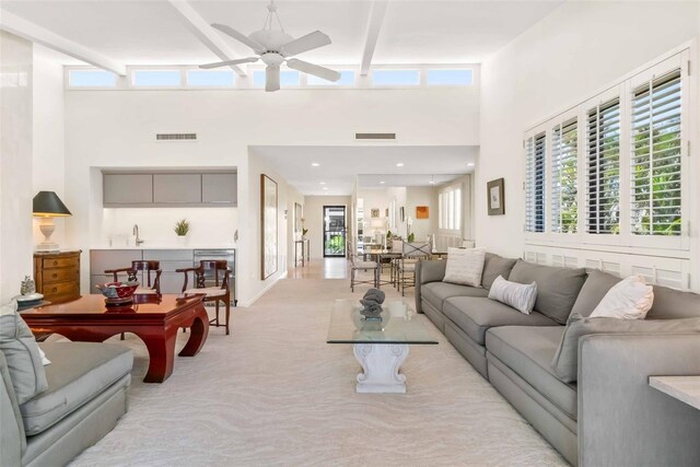 living area with a healthy amount of sunlight and visible vents