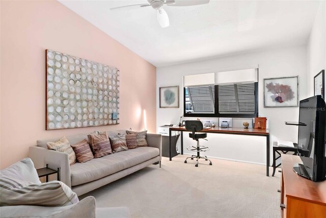 living room with carpet floors and ceiling fan