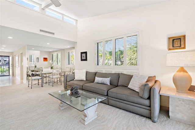 living area featuring carpet, plenty of natural light, visible vents, and recessed lighting