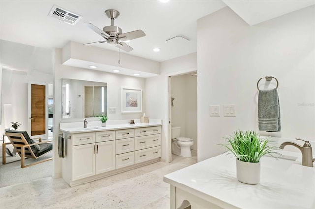 bathroom featuring recessed lighting, visible vents, toilet, ceiling fan, and vanity