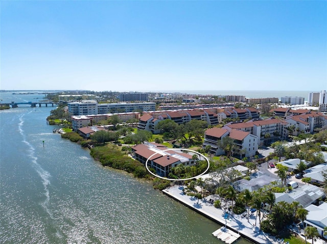 bird's eye view featuring a water view and a city view