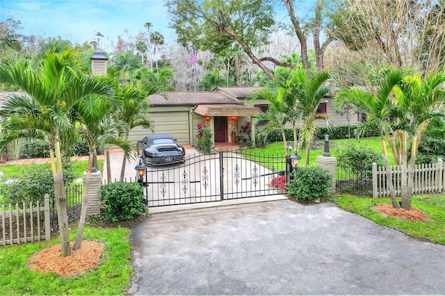 view of gate with a yard