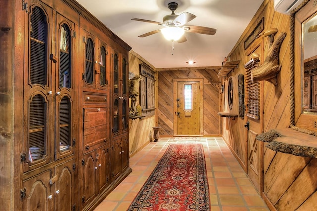 24120 Mink Rd, Astor, FL 32102 - entryway with wood walls, a ceiling fan, a wall mounted AC, and light tile patterned floors