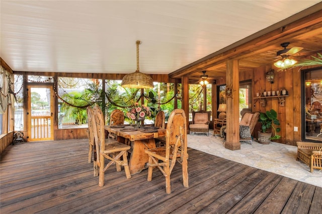24120 Mink Rd, Astor, FL 32102 - sunroom with a deck, wooden walls, and wood finished floors