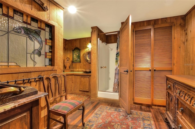 24120 Mink Rd, Astor, FL 32102 - full bath featuring wood walls, wood finished floors, and a stall shower