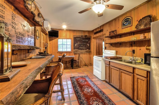 24120 Mink Rd, Astor, FL 32102 - kitchen with open shelves, electric range, wooden walls, a wall unit AC, and a ceiling fan