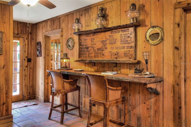 24120 Mink Rd, Astor, FL 32102 - indoor bar with wooden walls, ceiling fan, and stone finish flooring
