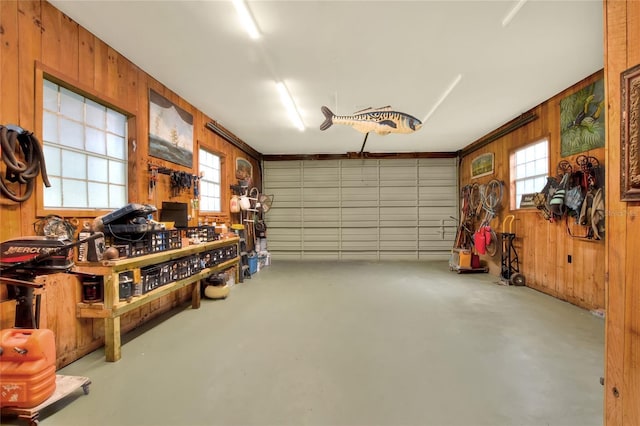 24120 Mink Rd, Astor, FL 32102 - garage with wood walls and a workshop area