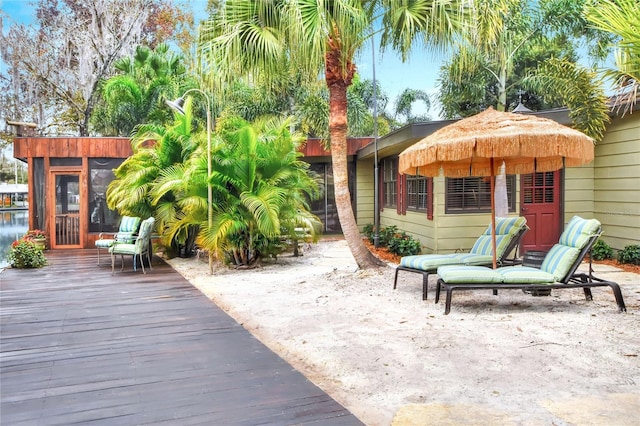 24120 Mink Rd, Astor, FL 32102 - view of patio featuring a sunroom and a deck