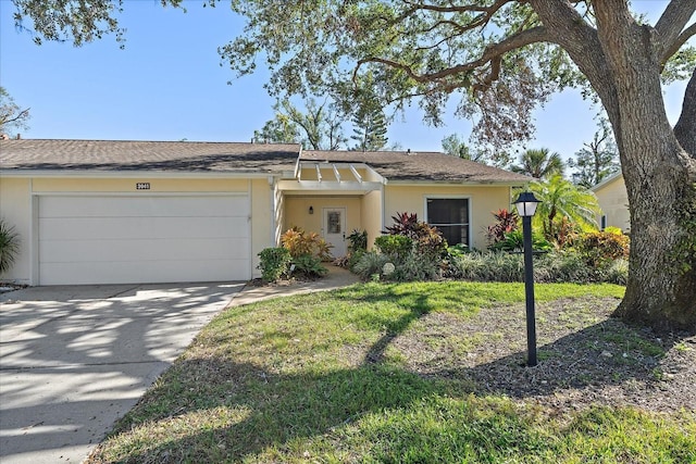 ranch-style home with a front yard and a garage