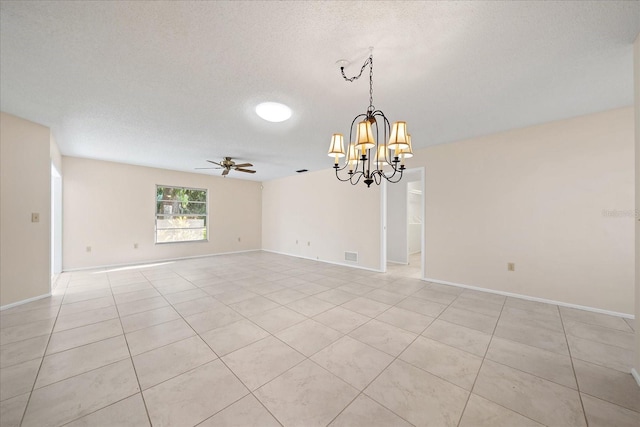 unfurnished room featuring a textured ceiling, light tile patterned floors, and ceiling fan with notable chandelier