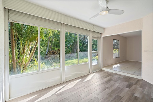 interior space with ceiling fan and a healthy amount of sunlight