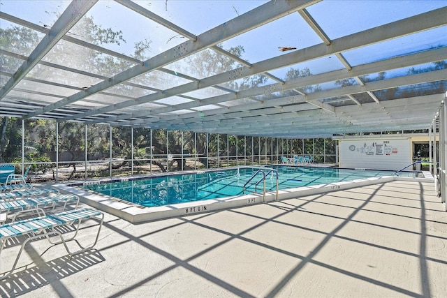 view of swimming pool with a patio