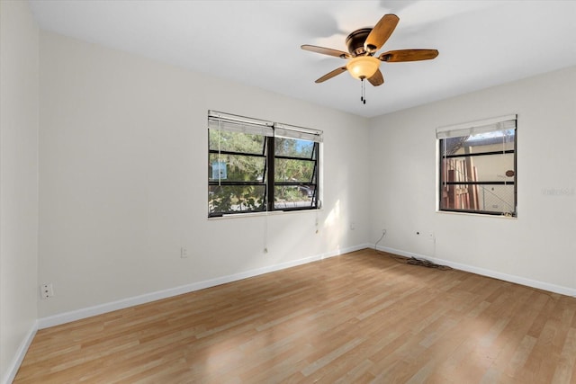 spare room featuring ceiling fan and light hardwood / wood-style flooring