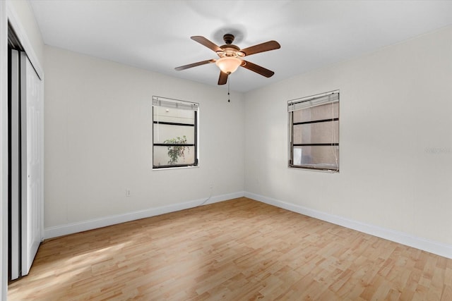 unfurnished bedroom featuring light wood-type flooring, a closet, and ceiling fan