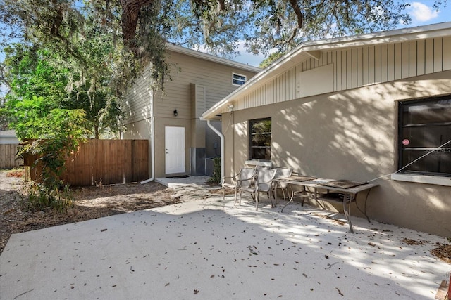 back of property with a patio