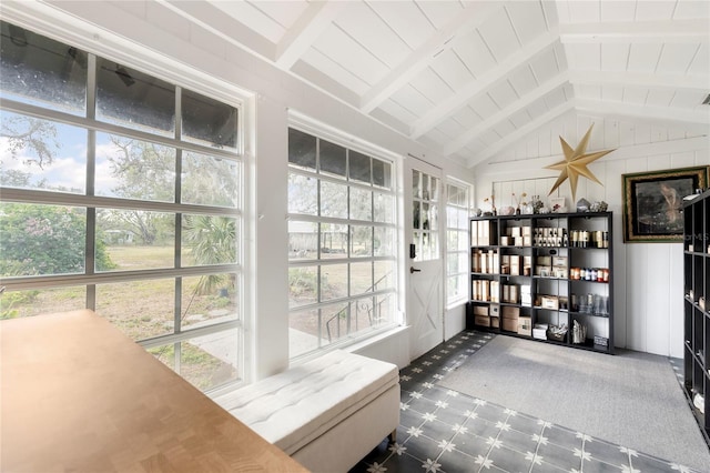 sunroom / solarium featuring vaulted ceiling with beams and wood ceiling