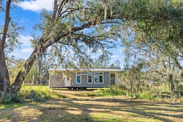 view of front of home with a front yard