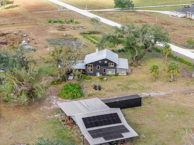 birds eye view of property featuring a rural view