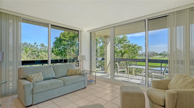 sunroom featuring a water view