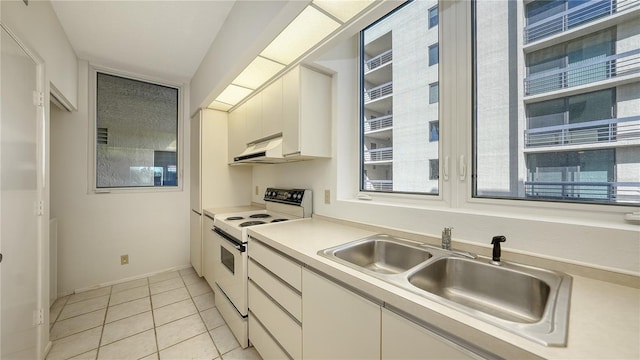 kitchen featuring white cabinets, sink, light tile patterned floors, white electric range oven, and extractor fan