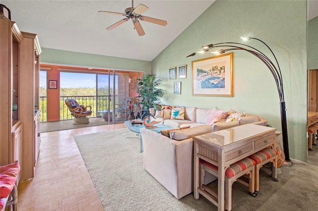 living room featuring ceiling fan, light parquet flooring, and high vaulted ceiling