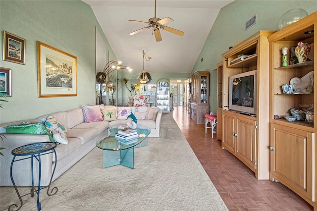 living room featuring ceiling fan, dark parquet flooring, and high vaulted ceiling