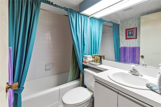 full bathroom featuring vanity, toilet, and shower / bathtub combination with curtain