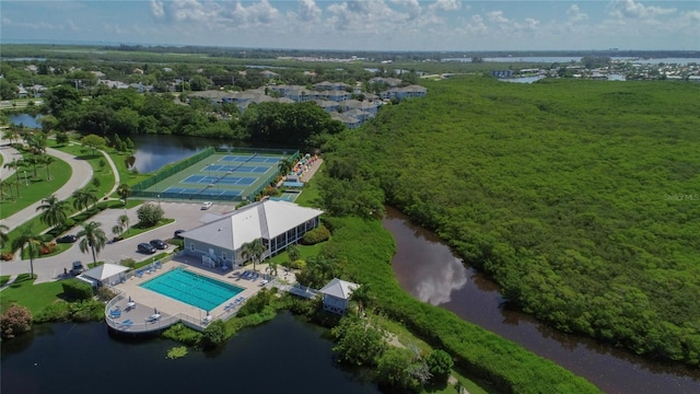 birds eye view of property with a water view