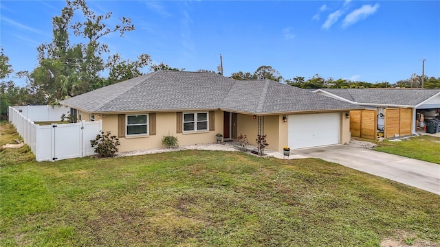 ranch-style house featuring a front lawn and a garage