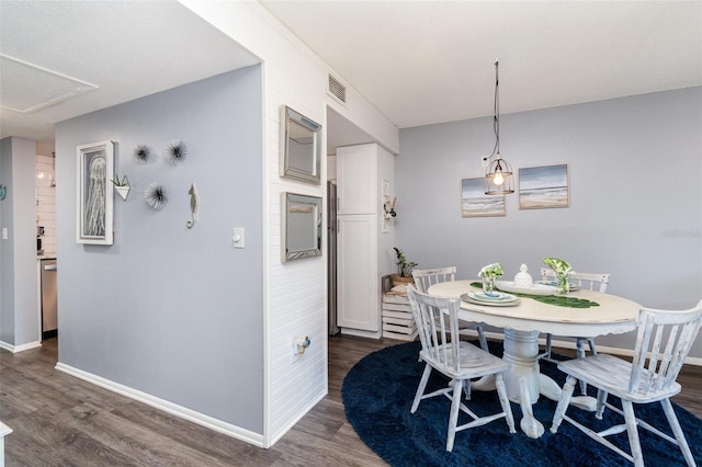 dining area with dark wood-type flooring