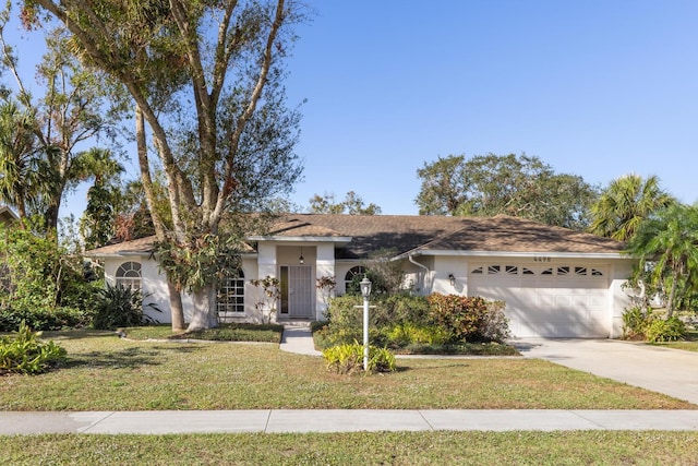 ranch-style house with a garage and a front yard