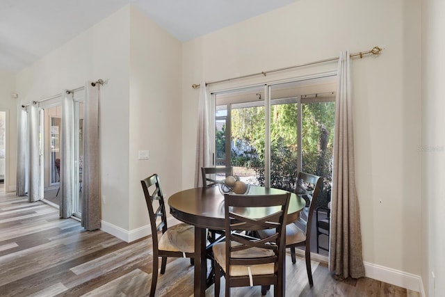 dining area with wood-type flooring