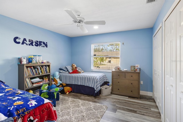 bedroom featuring hardwood / wood-style flooring and ceiling fan