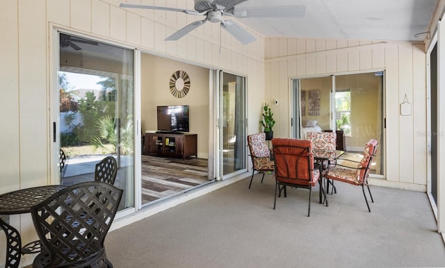 sunroom featuring ceiling fan and lofted ceiling