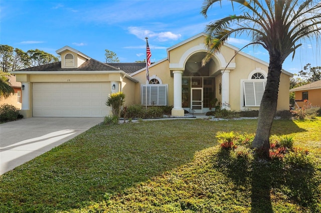 ranch-style home featuring a front yard and a garage