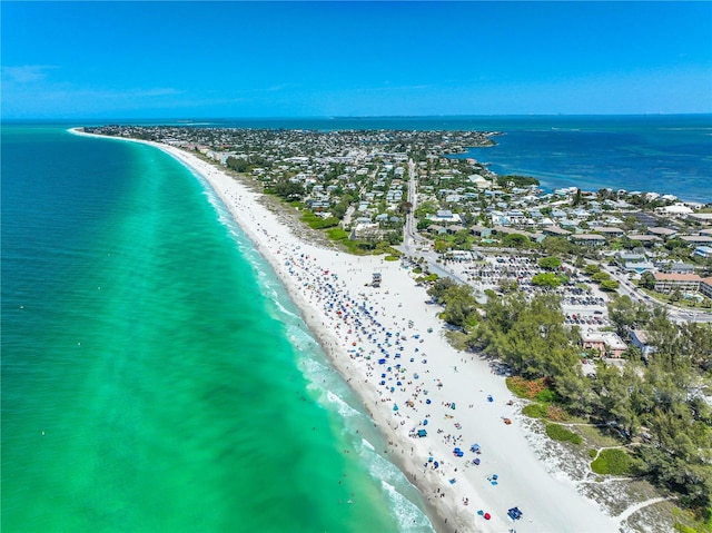 aerial view featuring a view of the beach and a water view