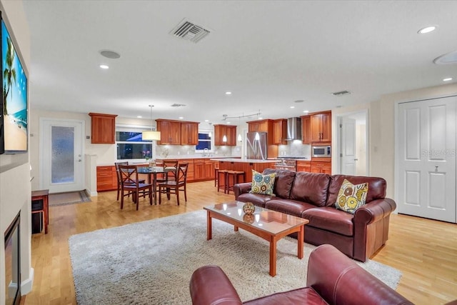 living room with light hardwood / wood-style floors