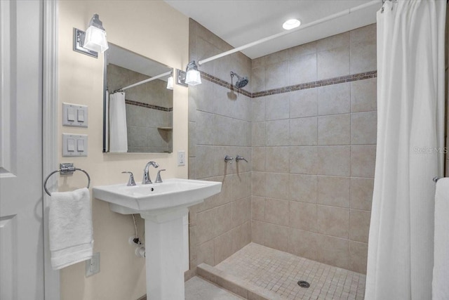 bathroom with sink and walk in shower