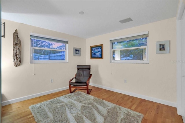 sitting room featuring wood-type flooring