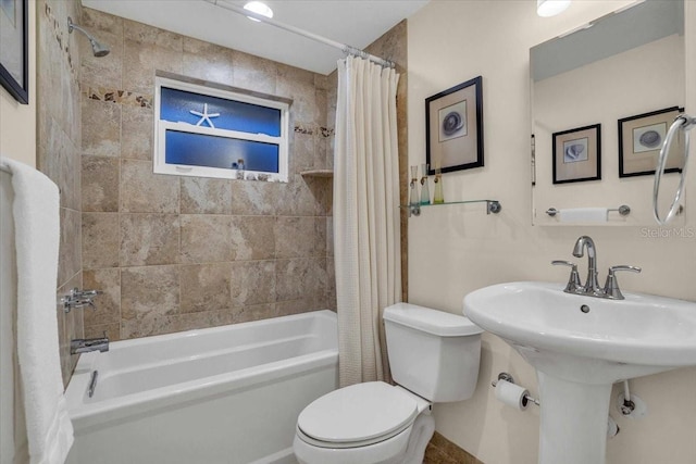 bathroom with shower / tub combo with curtain and toilet