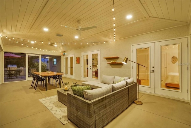 interior space with ceiling fan, french doors, wood ceiling, and vaulted ceiling