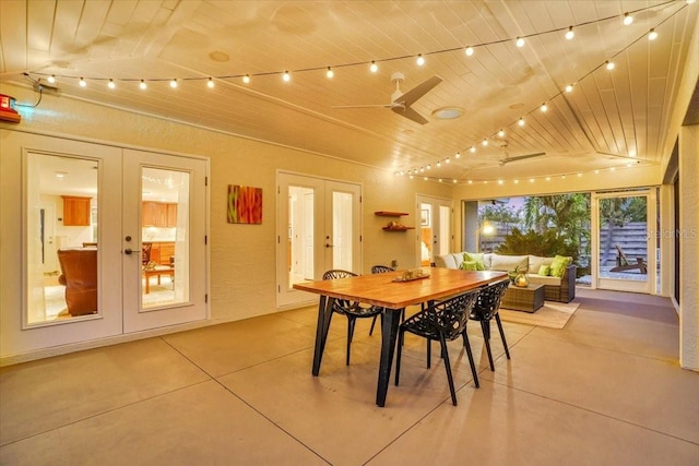 dining space with french doors, ceiling fan, lofted ceiling, and wood ceiling