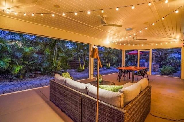 exterior space featuring ceiling fan and wood ceiling