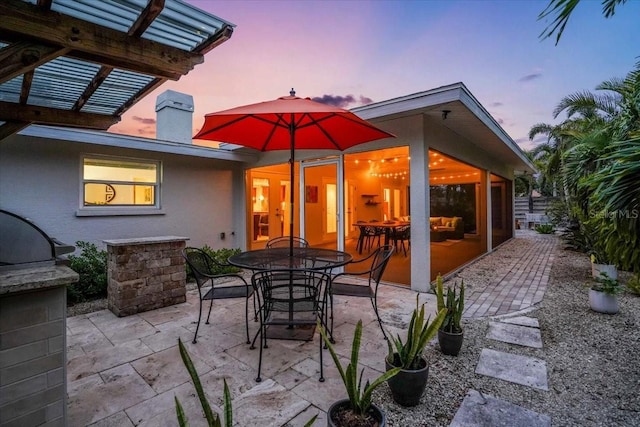 view of patio terrace at dusk