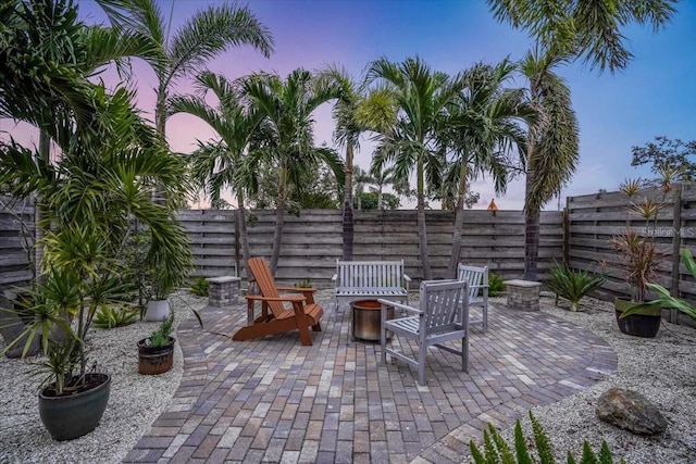 patio terrace at dusk with an outdoor fire pit