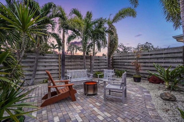 patio terrace at dusk with an outdoor fire pit